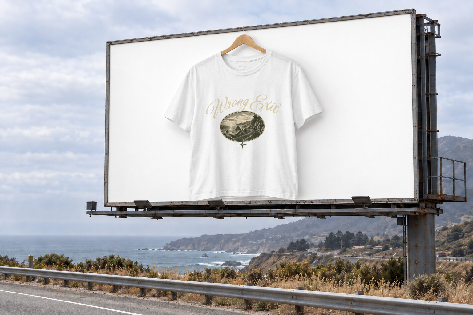 Wrong Exit coastal road tee displayed on a billboard above the Pacific coast